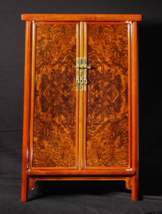 Cabinet with bookmatched walnut burl doors