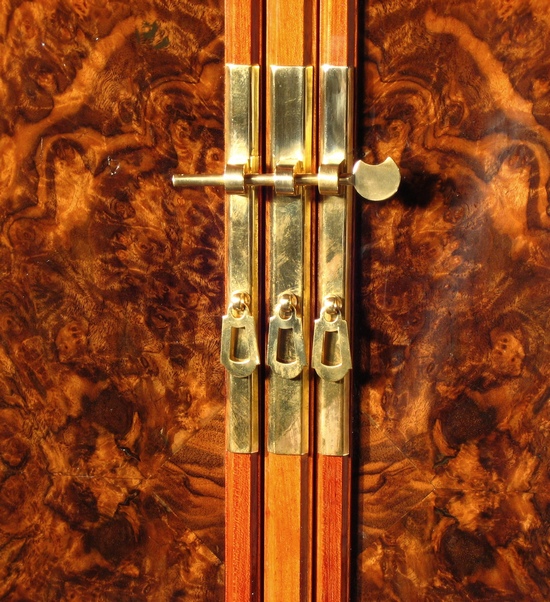 Locks and drawer pulls in white brass