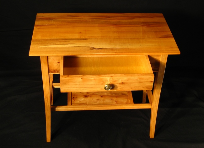 Bedside table with drawer opened