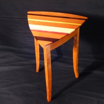 Triangular table of mixed woods