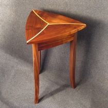 Triangular table of walnut